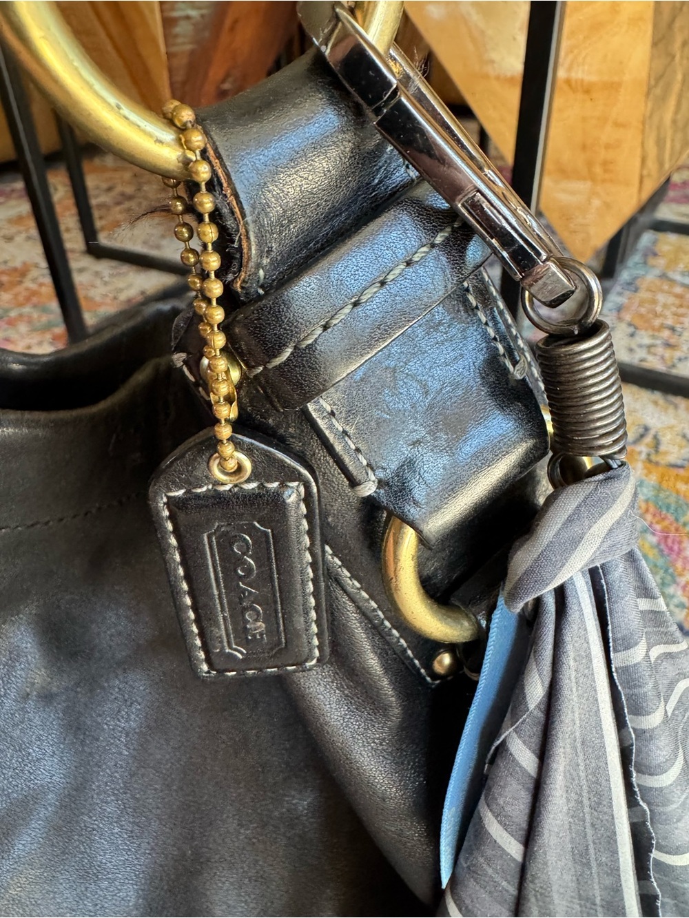 Coach Black Leather Shoulder Bag with Brass Hardware and Tassel